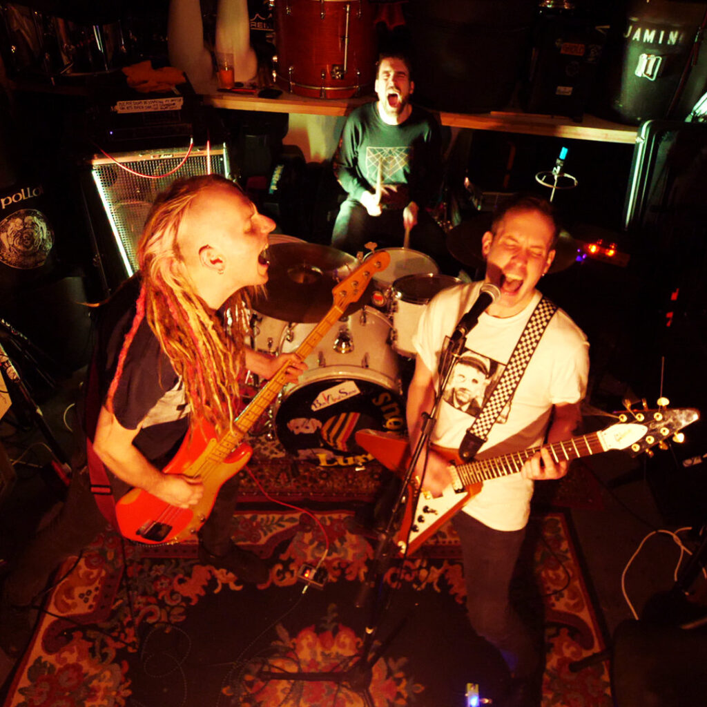 Ugly Mind with instruments in rehearsal room