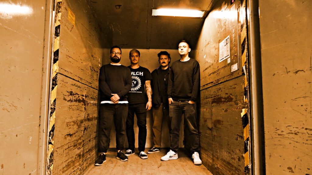 Band picture of Act the Fool standing in a cargo lift 